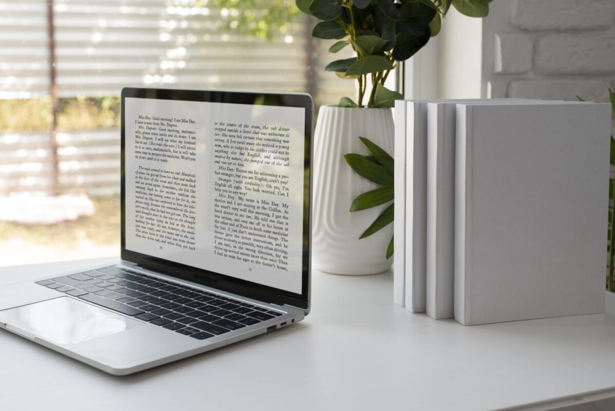 Picture of a laptop and books. Link to e-book page.